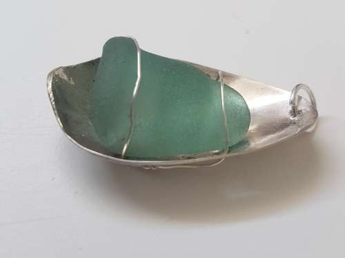 Smoky Seaglass in solid silver oval  setting with silver wire. 9.9  g!