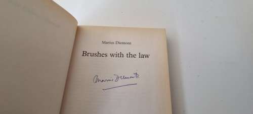 Brushes with the law. SIGNED BY MARIUS DIEMONT AND INSCRIBED TO MICK CORBETT, CHIEF JUSTICE