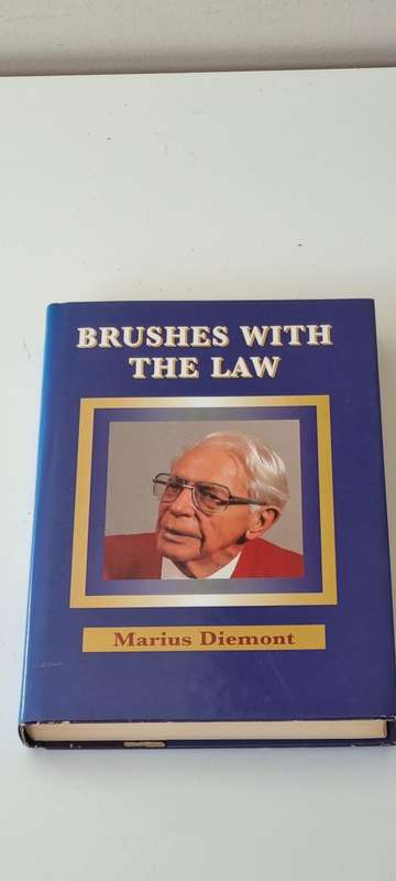 Brushes with the law. SIGNED BY MARIUS DIEMONT AND INSCRIBED TO MICK CORBETT, CHIEF JUSTICE