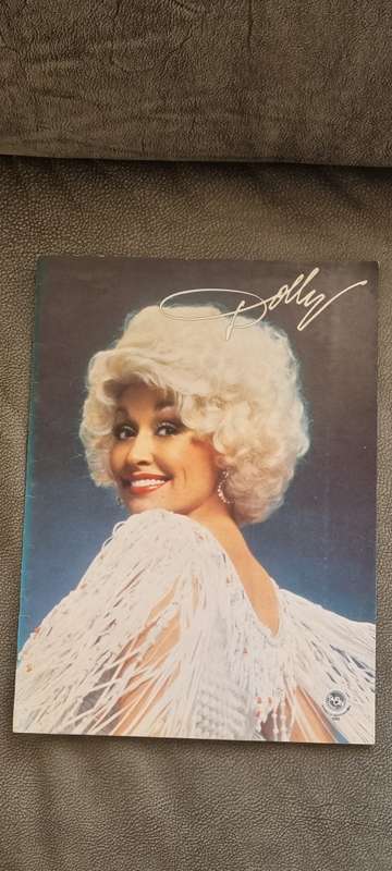 SIGNED AND INSCRIBED DOLLY PARTON PHOTO with Rare Sun City Program from 1982.