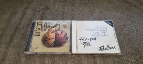 FlatStanley. 2 x SIGNED AND INSCRIBED CDS.  Between 2WO Worlds and Of Secrets and Wine.