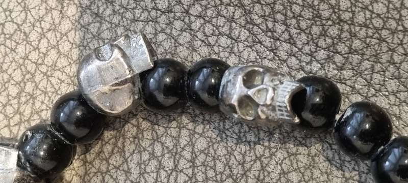 Black onyx stone bead stretch bracelet with 3 skull charms