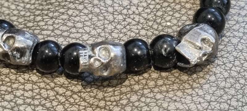 Black onyx stone bead stretch bracelet with 3 skull charms