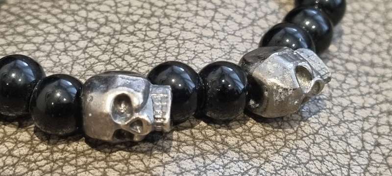 Black onyx stone bead stretch bracelet with 3 skull charms