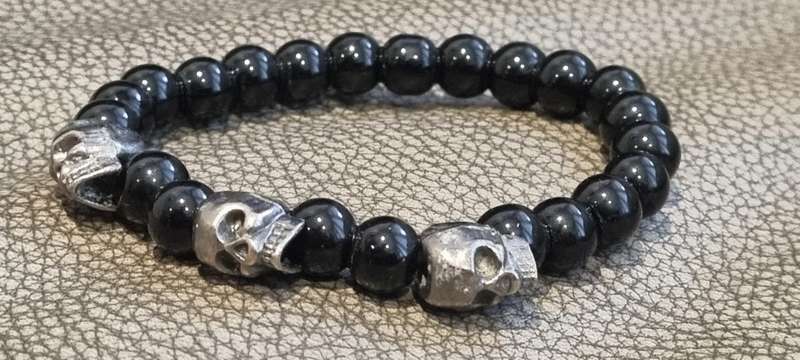 Black onyx stone bead stretch bracelet with 3 skull charms