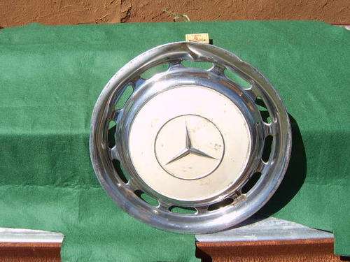 Mercedes Benz metal hub cap from a 123 series