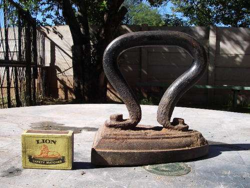Antique wood or coal iron used on a stove modified handle once off.