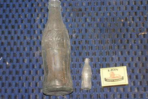 Ten green bottles hanging on the wall..........1937 coke cottle & miniture