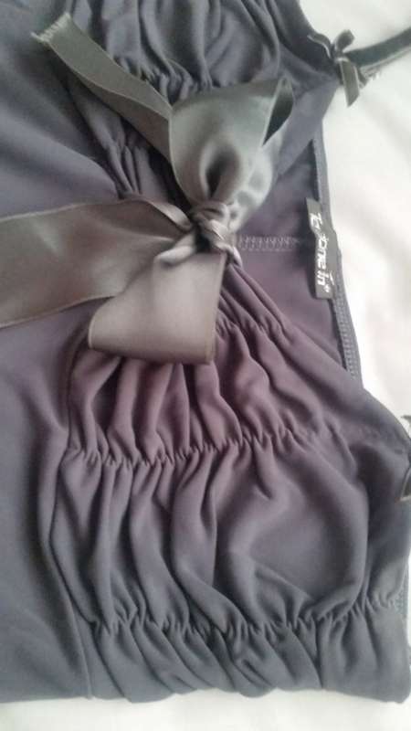 Silky grey strappy blouse, with bow detail