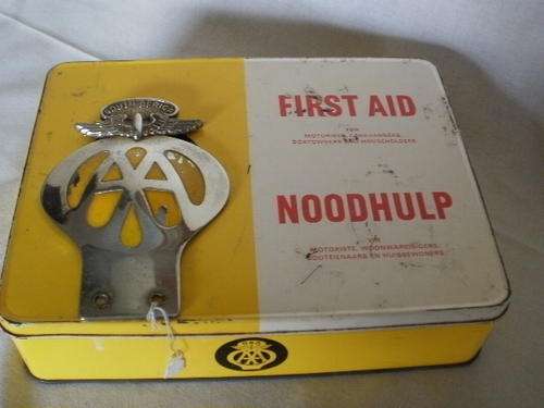 AA FIRST AID TIN AND A AA CAR BADGE (BOTH IN AFRIKAANS AND ENGLISH)