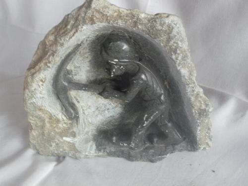 MINE WORKER CARVED OUT OF ROCK