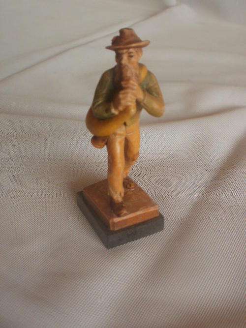 LITTLE WOODEN FIGURINE