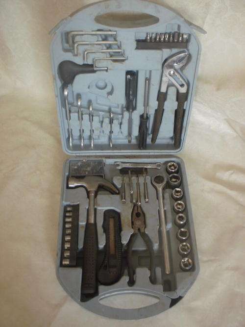 A SET OF HAND TOOLS IN A CASE