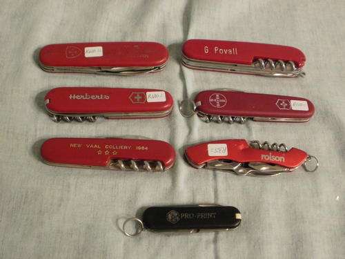 SEVEN ADVERTISING POCKET KNIFES, VICTORINOX