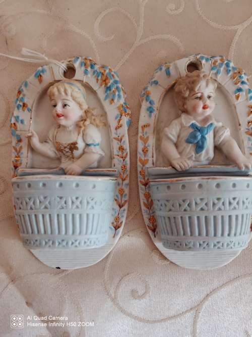 Two Bisque wall figurines