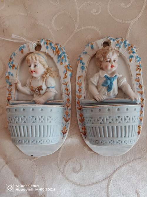 Two Bisque wall figurines