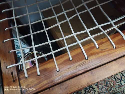 Cot with vertical slats strung with riempies
