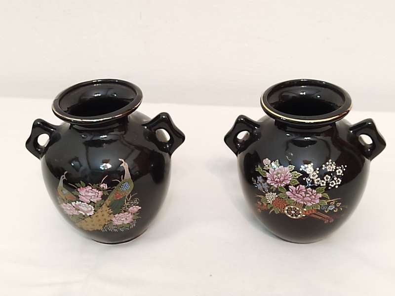 Two black vases