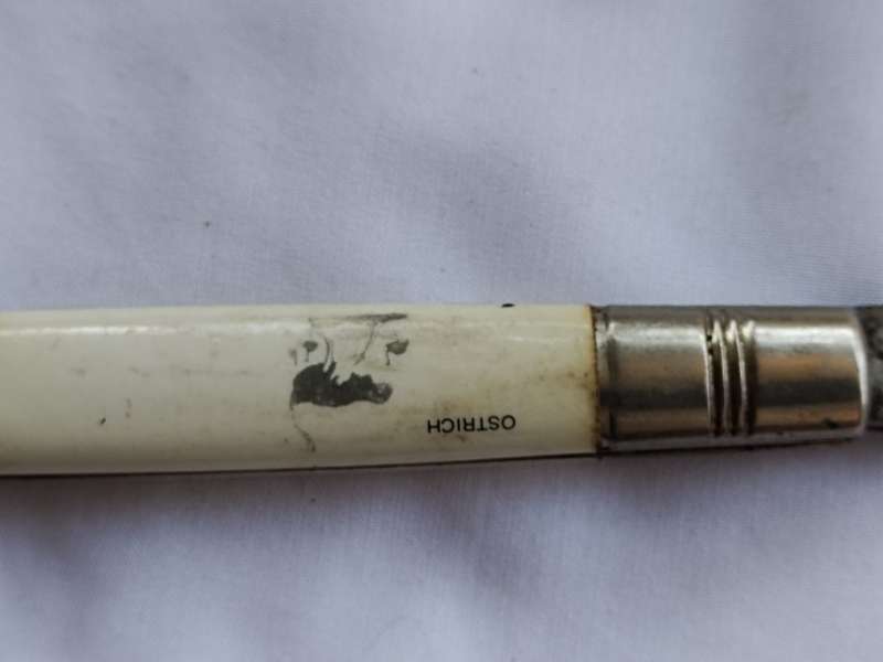 Three vintage pocket knifes two with animals and one union building