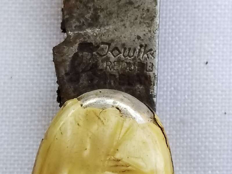 Three vintage pocket knifes two with animals and one union building