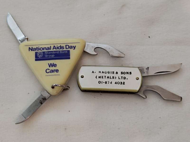Two Advertising pocket knifes