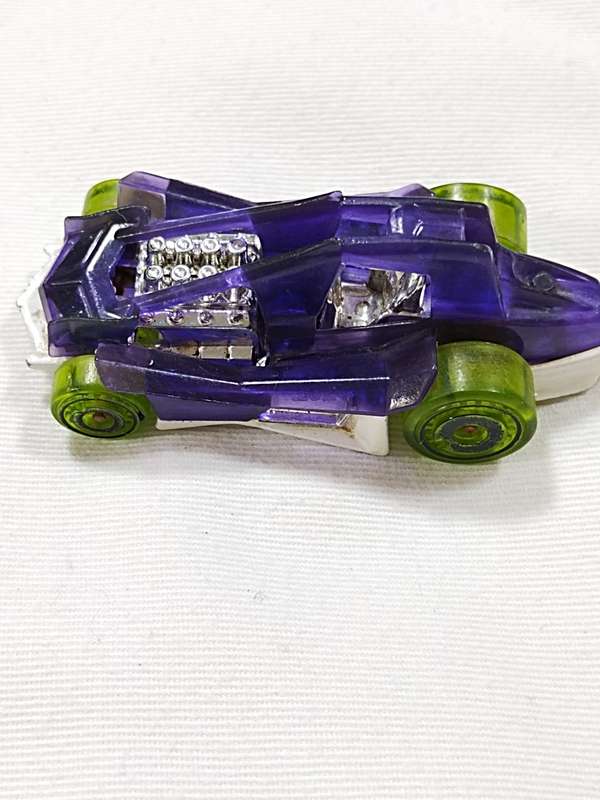 2011 HOT WHEELS DIRTY OUTLAW T9714 PURPLE DIECAST 2 3/4` CAR W/ GREEN TIRES