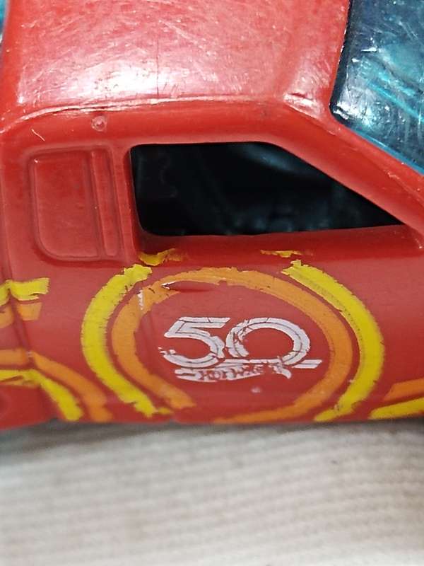 HOT WHEELS 50TH ANNIVERSARY `OFF TRACK` ~ RED WITH 50 LOGO ON SIDE
