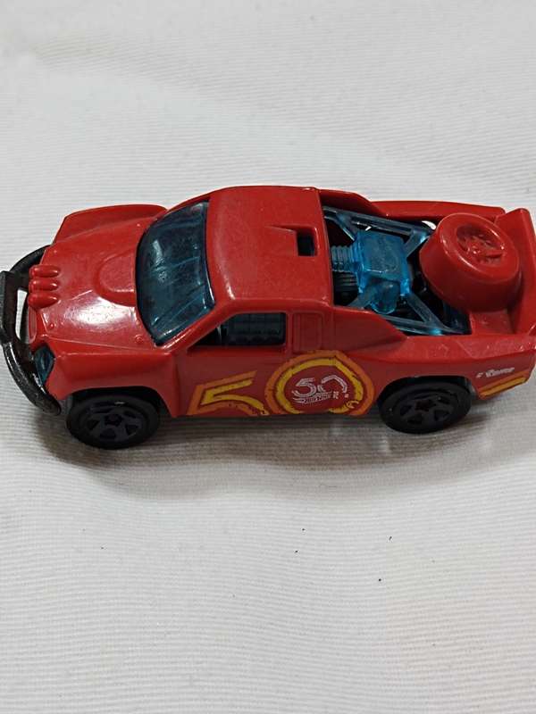 HOT WHEELS 50TH ANNIVERSARY `OFF TRACK` ~ RED WITH 50 LOGO ON SIDE