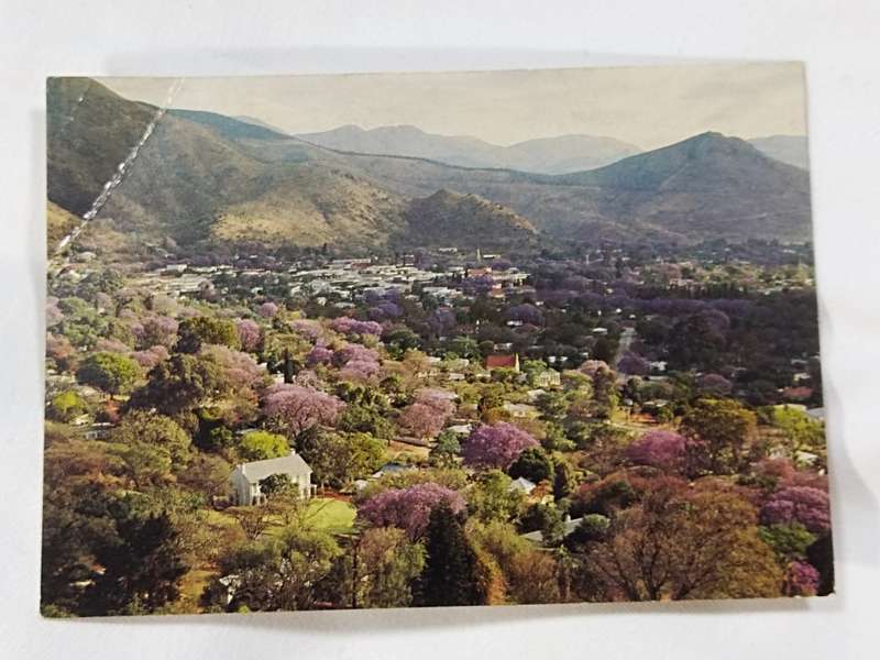 Barberton Eastern Transvaal `Gem of the Lowveld` during Jacaranda Time postcard