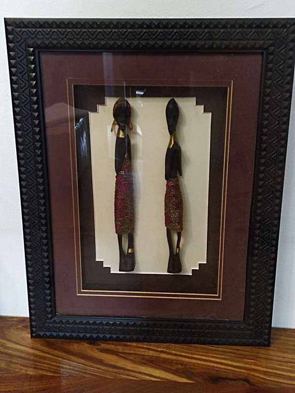 African carved figurines in a Box frame