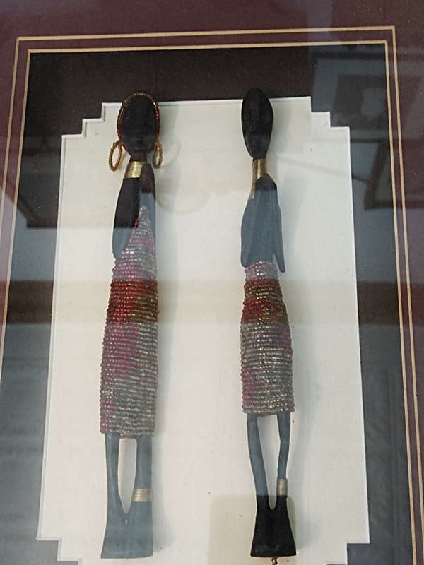 African carved figurines in a Box frame