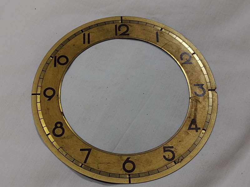 Gold tone clock dial