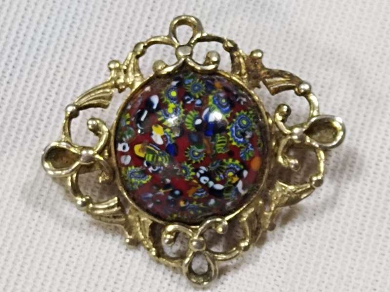 Millefiori style gold tone brooch