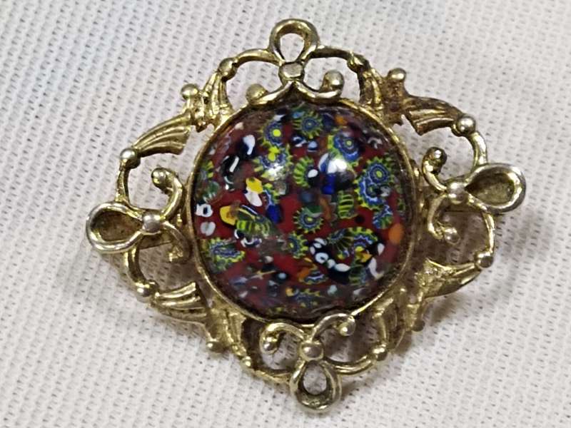 Millefiori style gold tone brooch