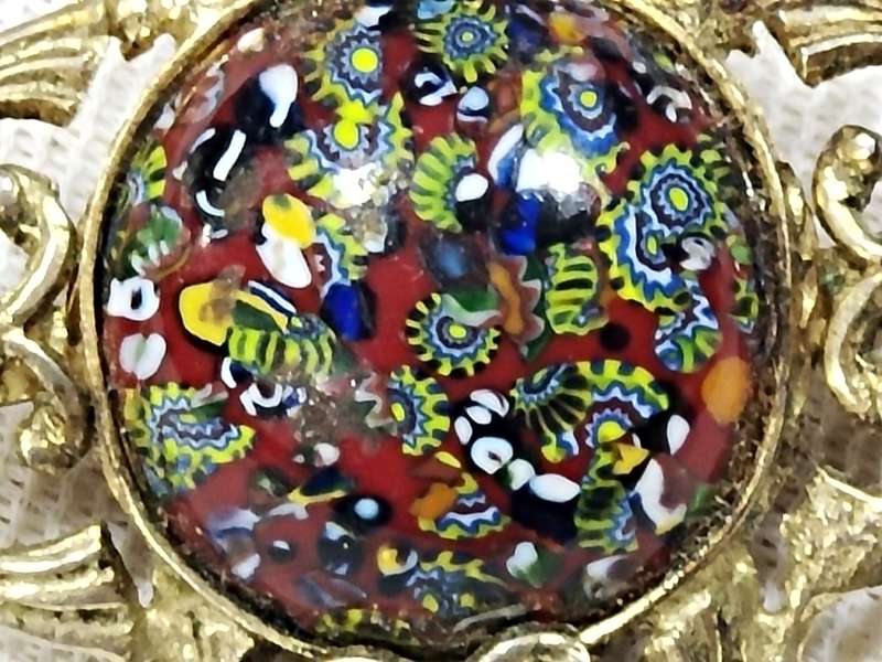 Millefiori style gold tone brooch