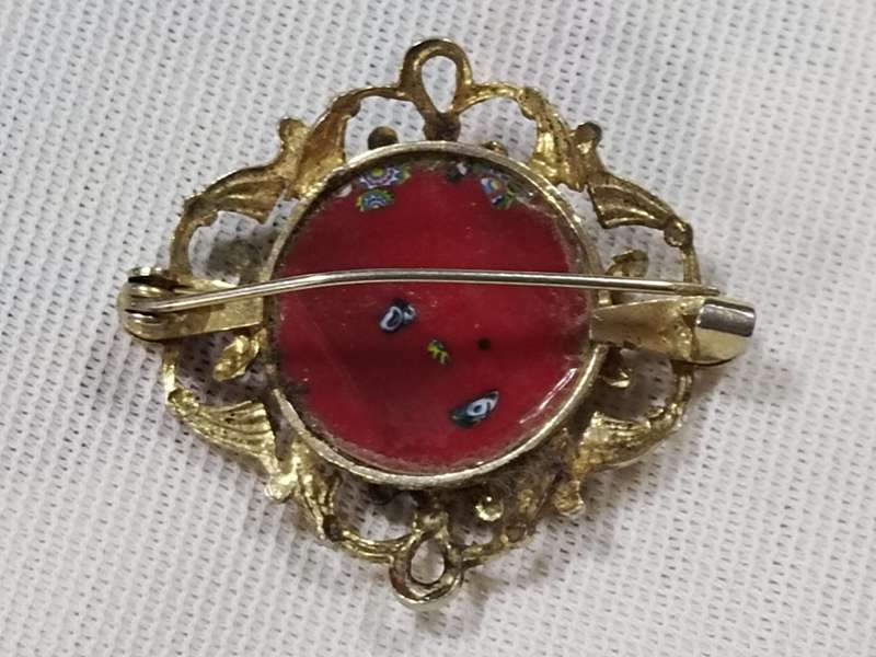 Millefiori style gold tone brooch