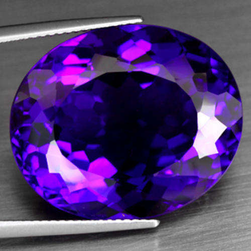 33.39 CARAT BRILLIANT PURPLE OVAL FACET AMETHYST