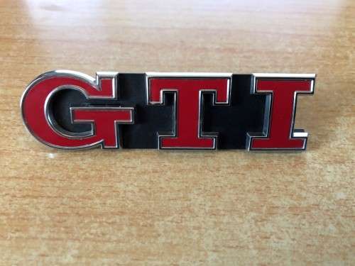 OEM Volkswagen Mk7 Red/Chrome GTI Grill badge part # 5G0853679P