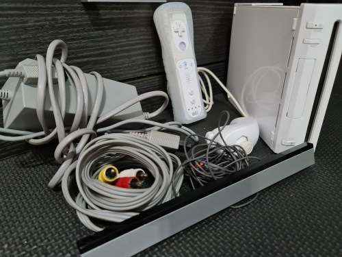 Wii Console white with all cables and remote with nunchucks.