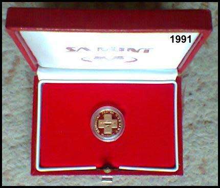 1991 - 1/10 Ounce Proof Gold Protea Nursing 100, Presented in a Round Capsule in a S. A. Mint Red Bo