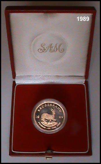 1989 1 Ounce Proof Gold Krugerrand Sealed in a Round Capsule  in a S.A Mint Red Box.