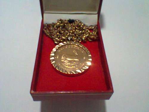 1981 - 1 Ounce Gold Krugerrand On a 14 Carats Gold Mounting With a 9 Carats Gold Chain in a S. M. Re