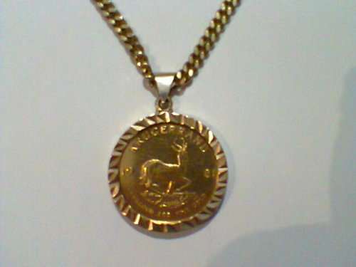 1981 - 1 Ounce Gold Krugerrand On a 14 Carats Gold Mounting With a 9 Carats Gold Chain in a S. M. Re
