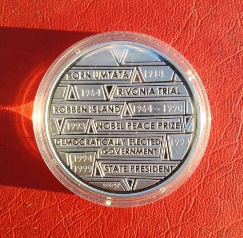 SILVER 1 OUNCE LIFE OF MANDELA MEDALLION. PROOF SEALED IN PLASTIC.