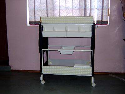 Baby bath with changing nappy folder and racks
