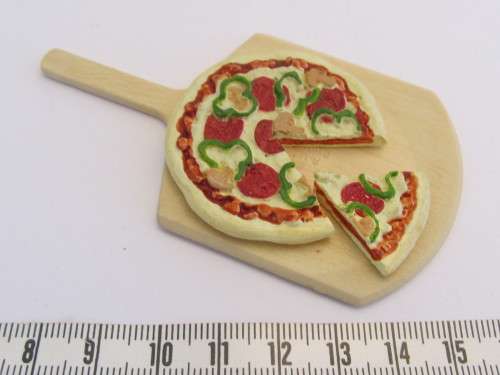 Dollhouse pizza on baking board as new