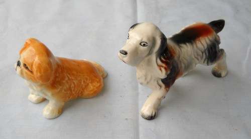 PAIR OF PORCELAIN DOG FIGURINES / ORNAMENTS-SPANIEL & PEKINGESE-VERY GOOD CONDITION