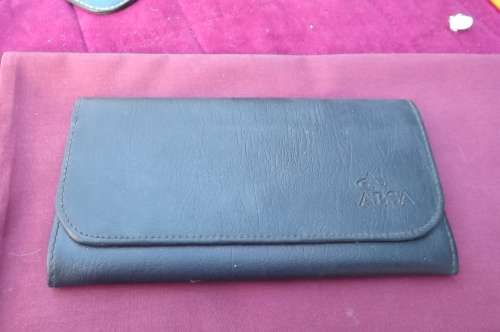 As new ABSA wallet in black.Close with clip.Suitable for notes and cards.Zip at side for change.