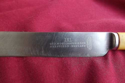 Geo-Wostenholm + son sheffield vintage dinner knife with IXL marking with bone handle.See scan