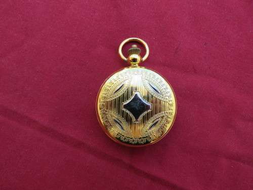 Beautiful gold toned quartz pocket watch.Roman and normal letters.Working.New condition